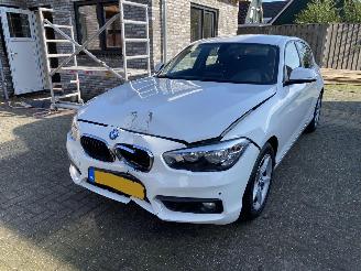 damaged passenger cars BMW 1-serie 118i 5drs Vaste Prijs 2016/1