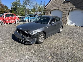 damaged passenger cars BMW 1-serie 116i 2010/2