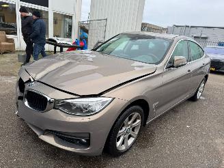 uszkodzony samochody osobowe BMW 3-serie Gran Turismo 320i Executive BJ 2014 202.816 KM 2014/1
