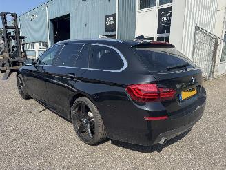 Schadeauto BMW 5-serie 520i Luxury Edition 2014/5