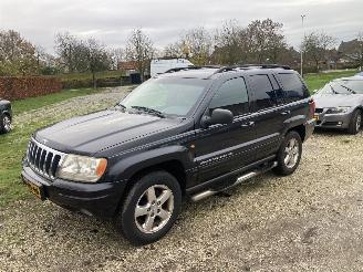 damaged passenger cars Jeep Grand-cherokee 4.7 V8 BENZINE 4X4 1999/4