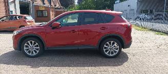 Mazda CX-5 2.2 175pk Automatik 4x4 Navigatie Xenon Climatecontrol CruiseControl Stoelverwarming Lichtautomaat Privacyglas Regensensor Achteruitrijcamera Keyless entry 2014/7