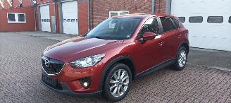 skadebil auto Mazda CX-5 4WD Diesel Navigatie Xenon Leder Bose-sound Climatecontrol CruiseControl Stoelverwarming Lichtautomaat Privacyglas keyless Entry trekhaak Parkeersensoren Achteruitrijcamera 2014/7