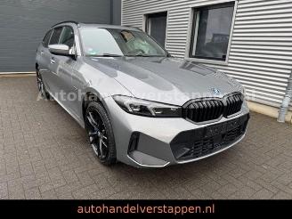 Schadeauto BMW 3-serie 0e xDrive Touring M Sport Pano Harman AHK 2022/11
